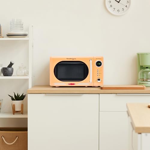 Nostalgia Retro Compact Countertop Microwave Oven - 0.7 Cu. Ft. - 700-Watts with LED Digital Display - Child Lock - Easy Clean Interior - Pink